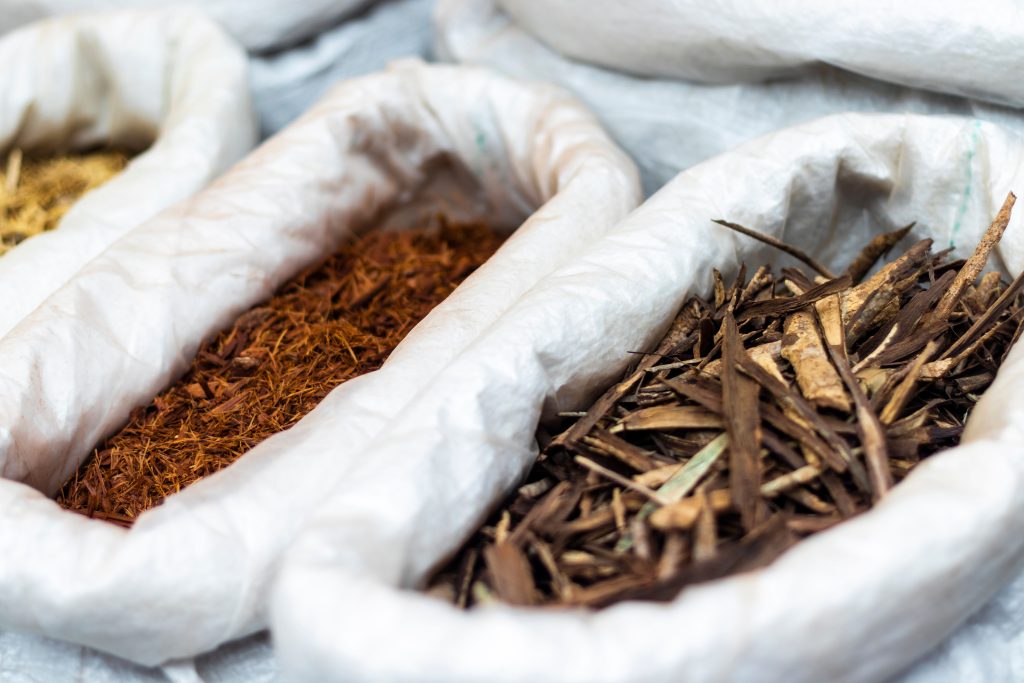 Variety of dried herbs displayed in a São Paulo market, ideal for traditional healing.